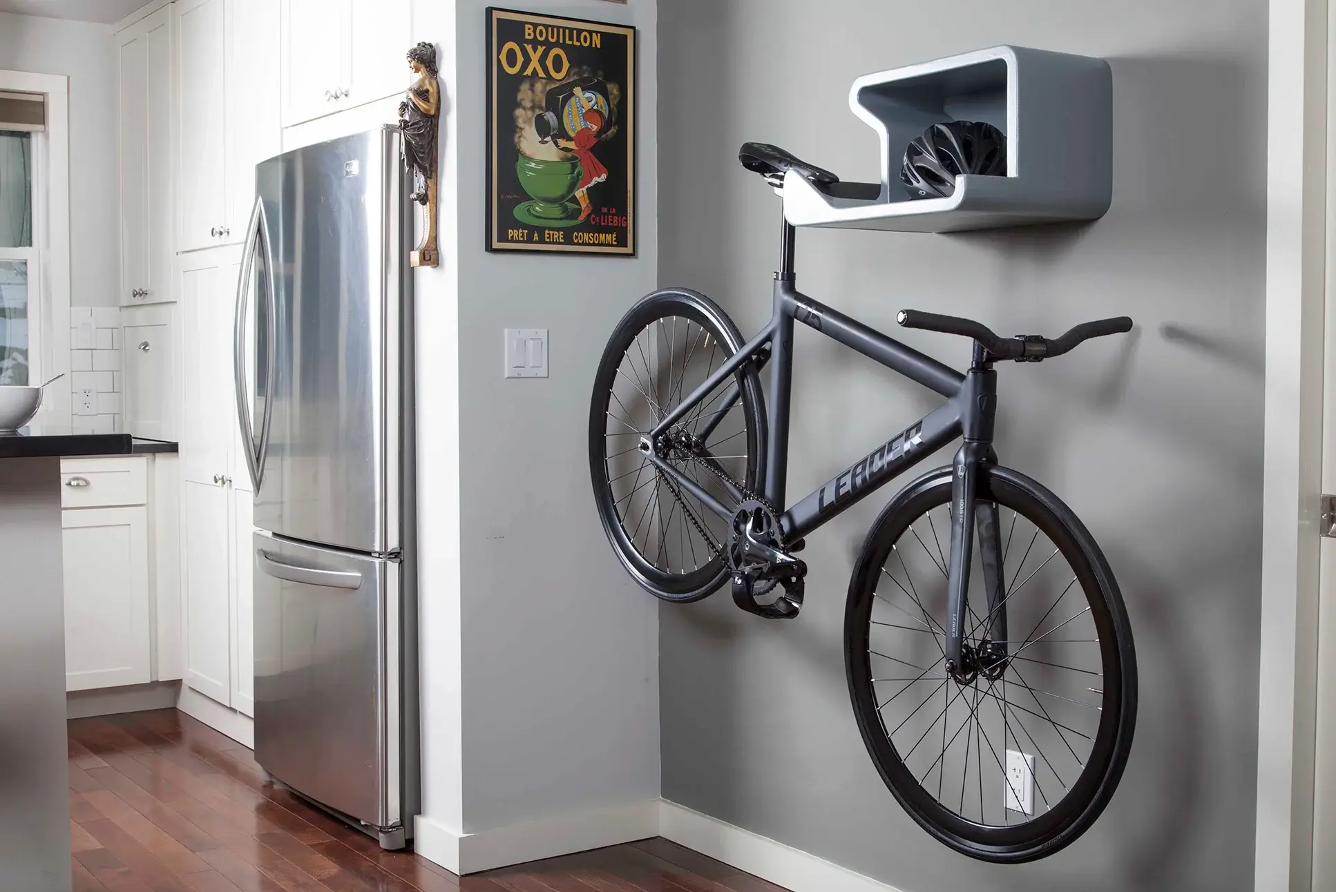 Bike hanging from a horizontal wall mount.