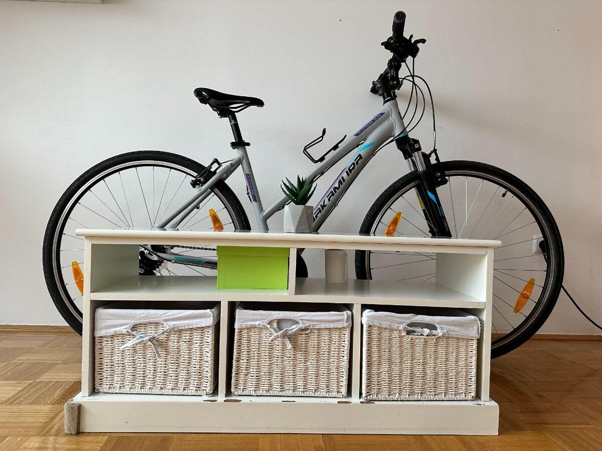 Bike stored behind a piece of furniture